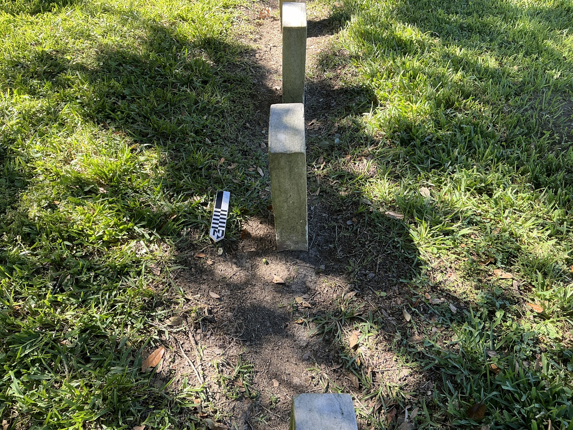 Extra image of historic upright marble headstone with recessed shield face.