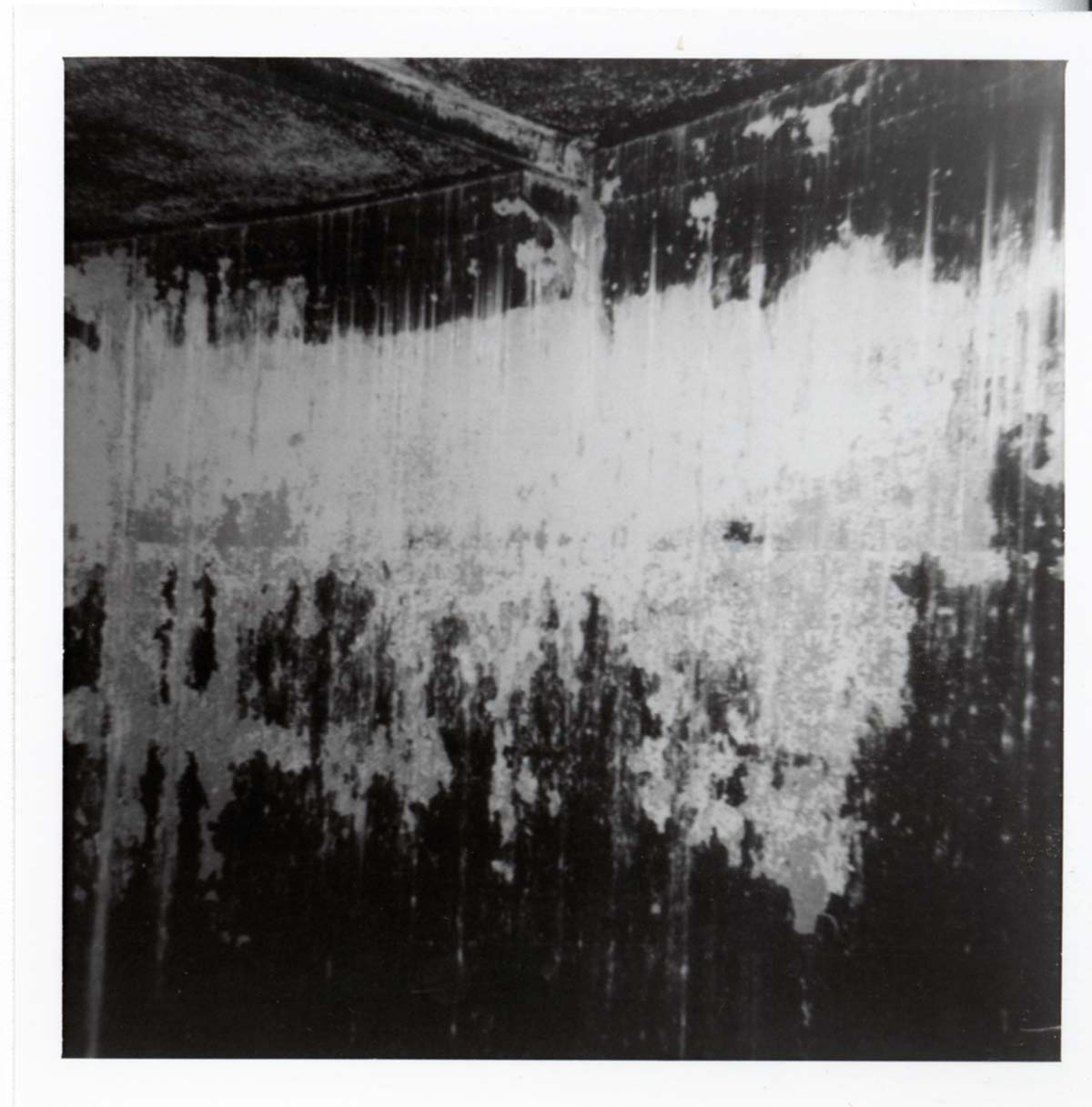 The interior of the 40000 gallon water tank showing buildup/corrosion.