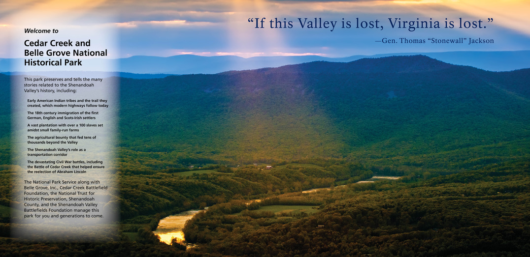 A wall-sized exhibit shows a photograph of a lush mountain valley and text that welcomes the reader to a national park.