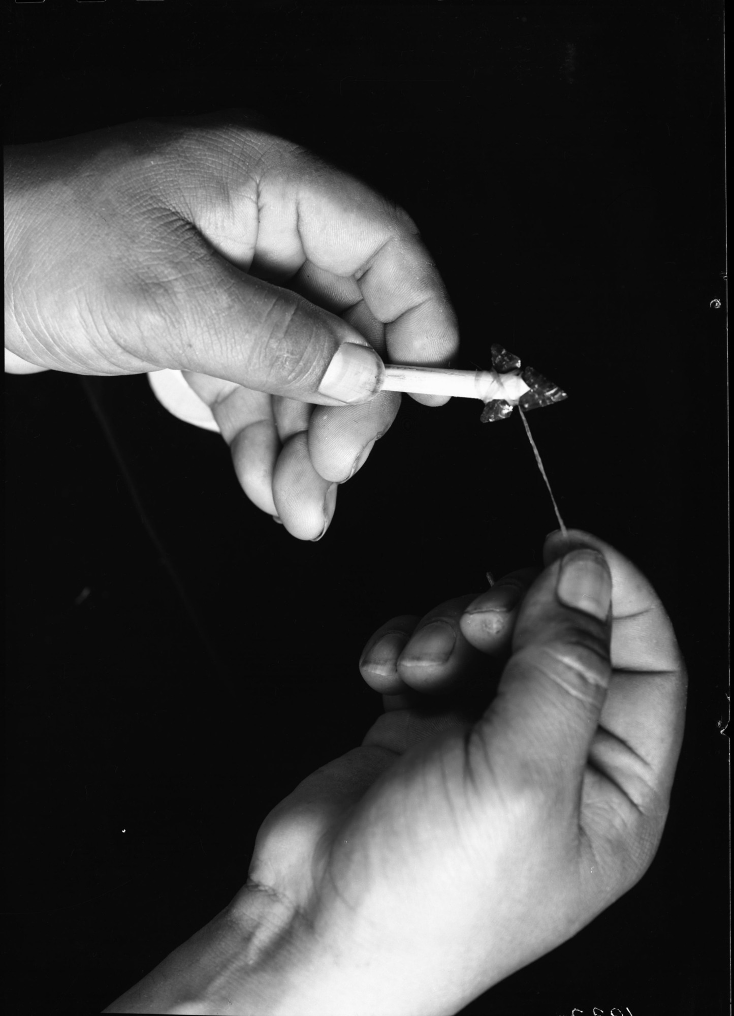 Le-me attaching arrow point to shaft.