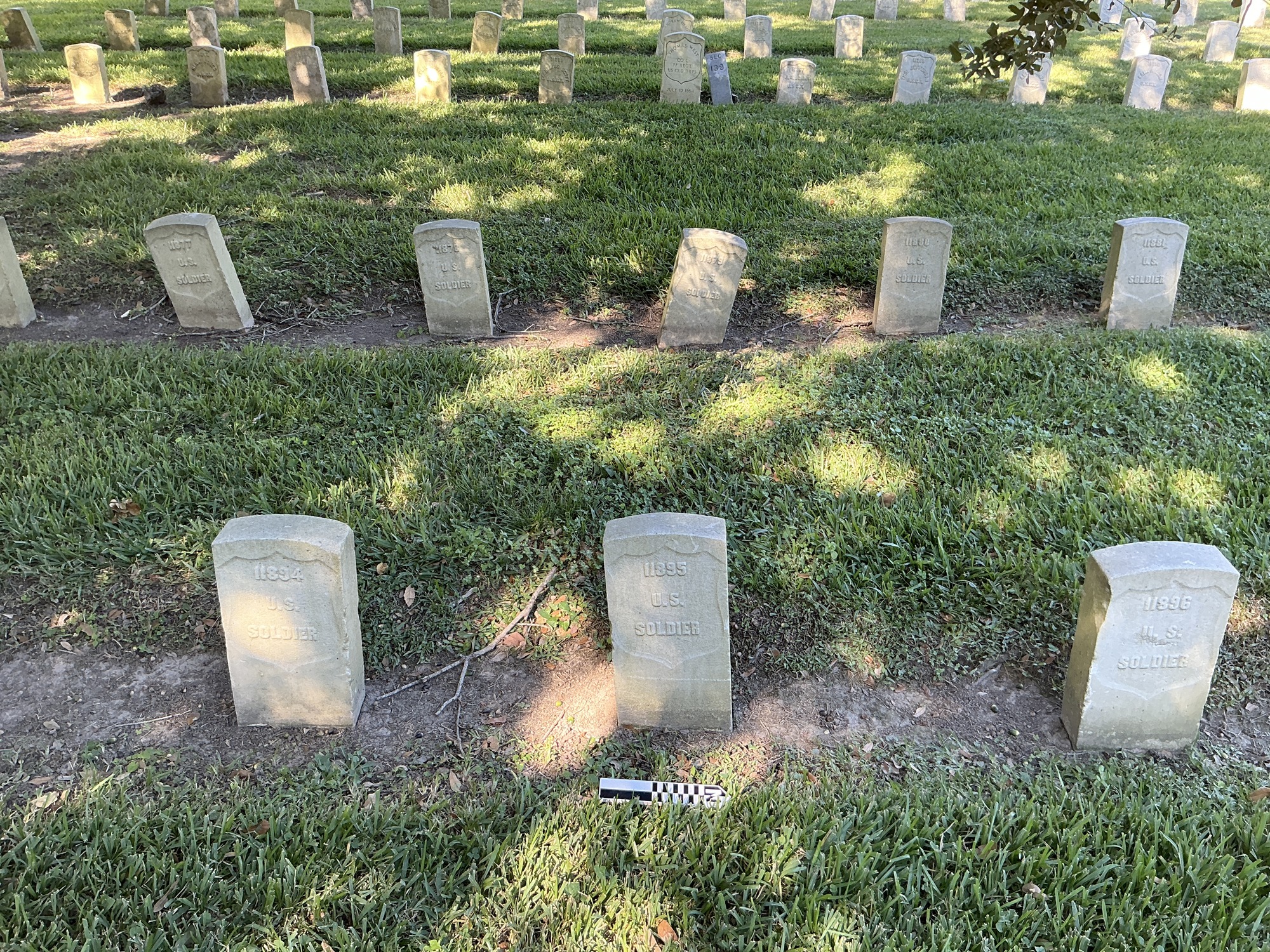 Extra image of historic upright marble headstone with recessed shield face.