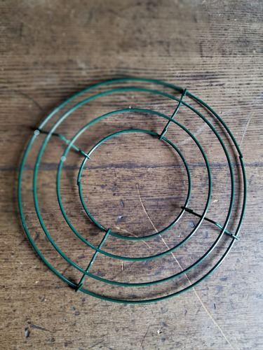 A green wire wreath frame.