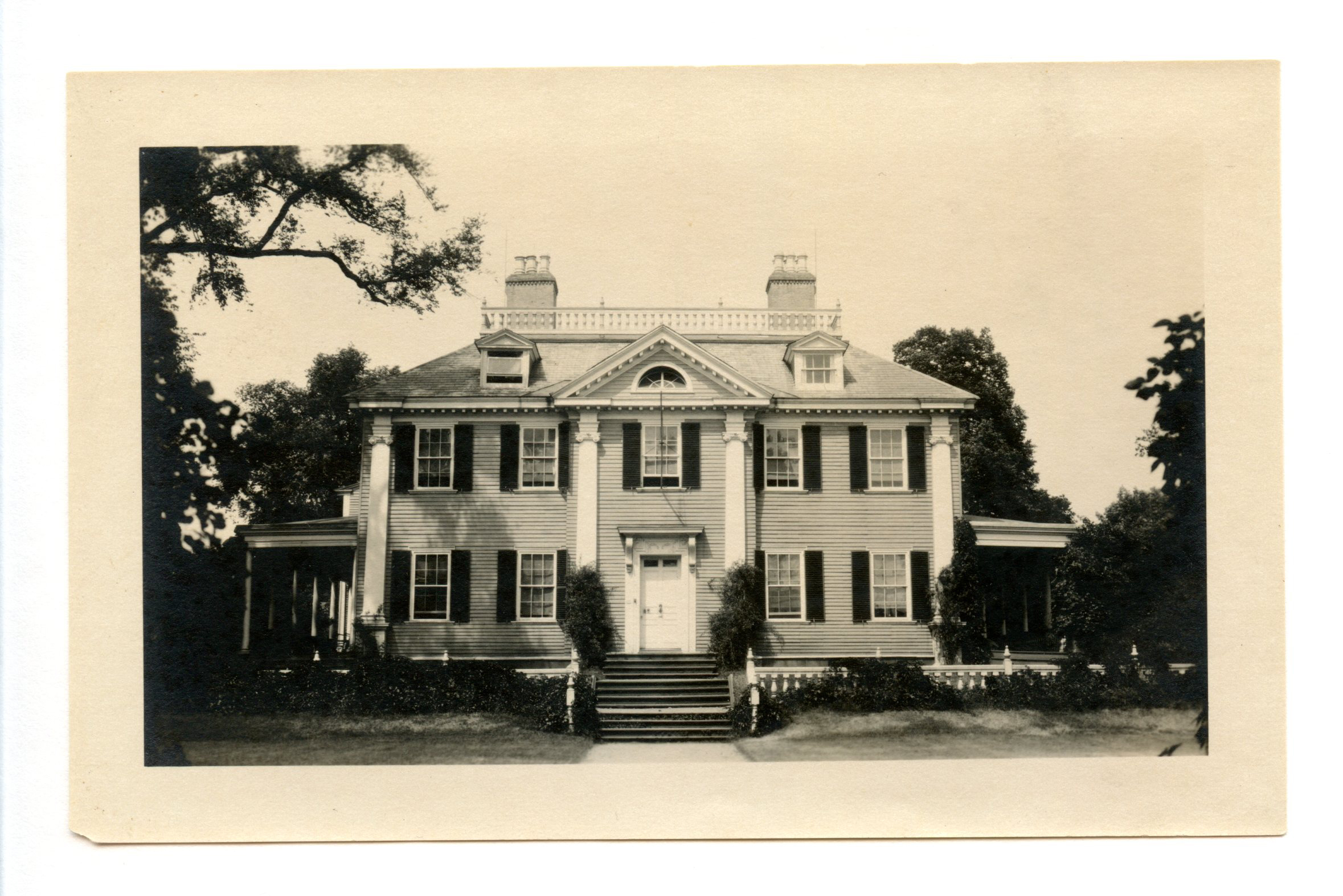 Black and white photograph of Georgian mansion.