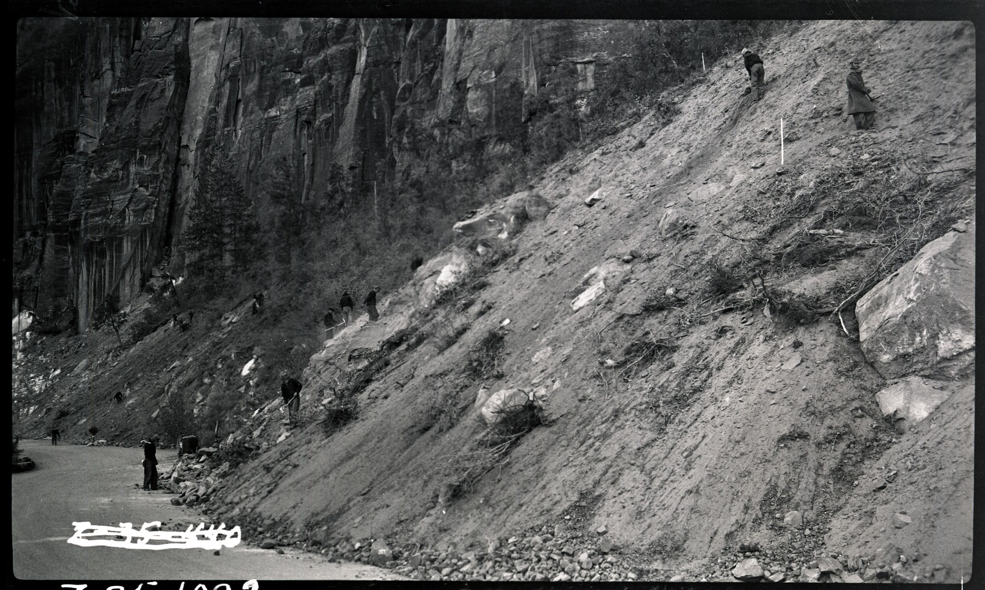 Workers engaged in bank stabilization above the Zion Mt Carmel Highway.