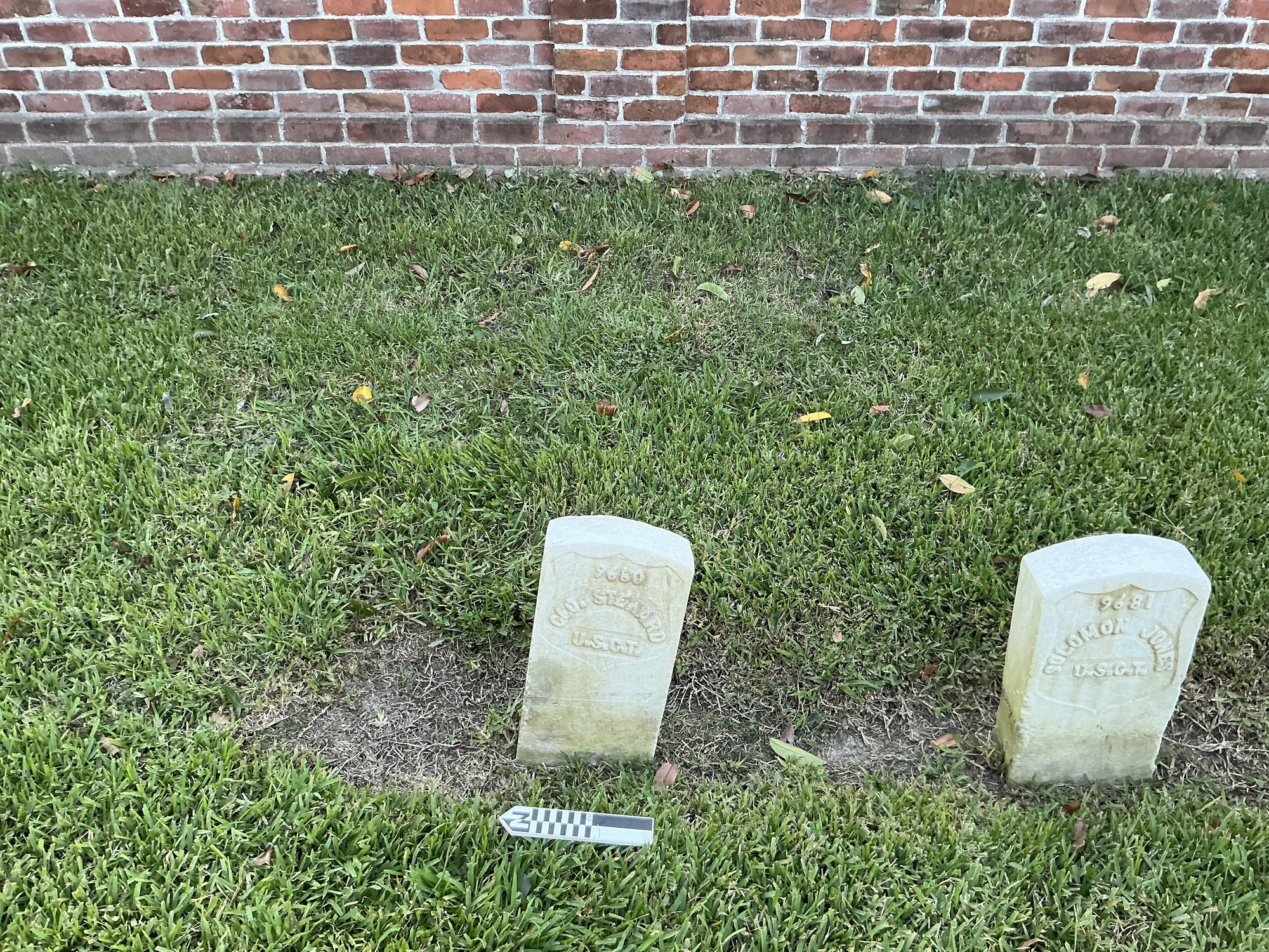 Extra image of historic upright marble headstone with recessed shield with recessed lettering face.