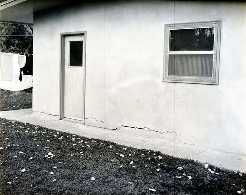 Cracks in stucco of garage wall- faulty construction, residence Building 39.