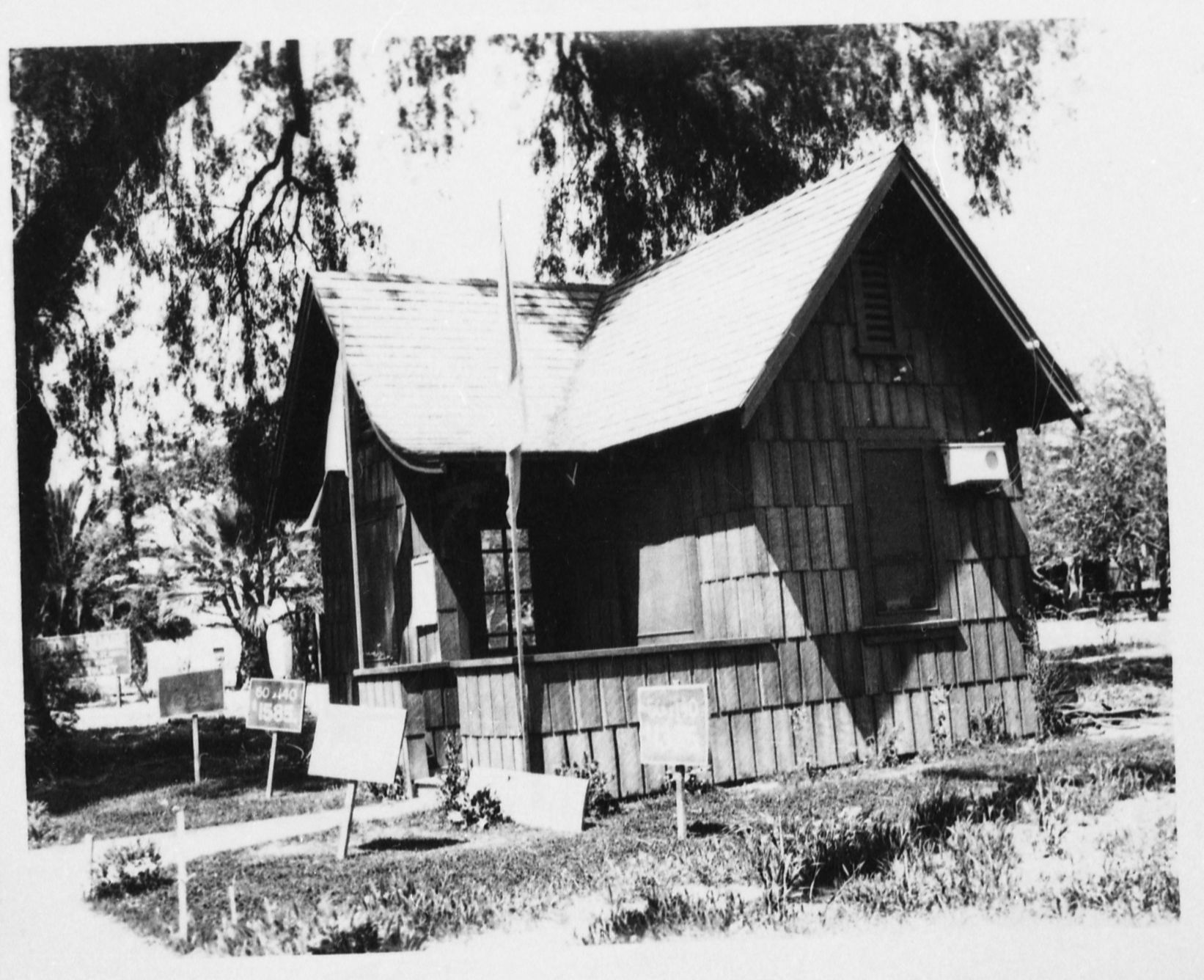 Out of YNP (note palm trees). The building may have been moved from Yosemite (looks similar to Y. P. & C. Co. residences on Ahwahnee Row. Photo donated to YNP by Audrey Harris.