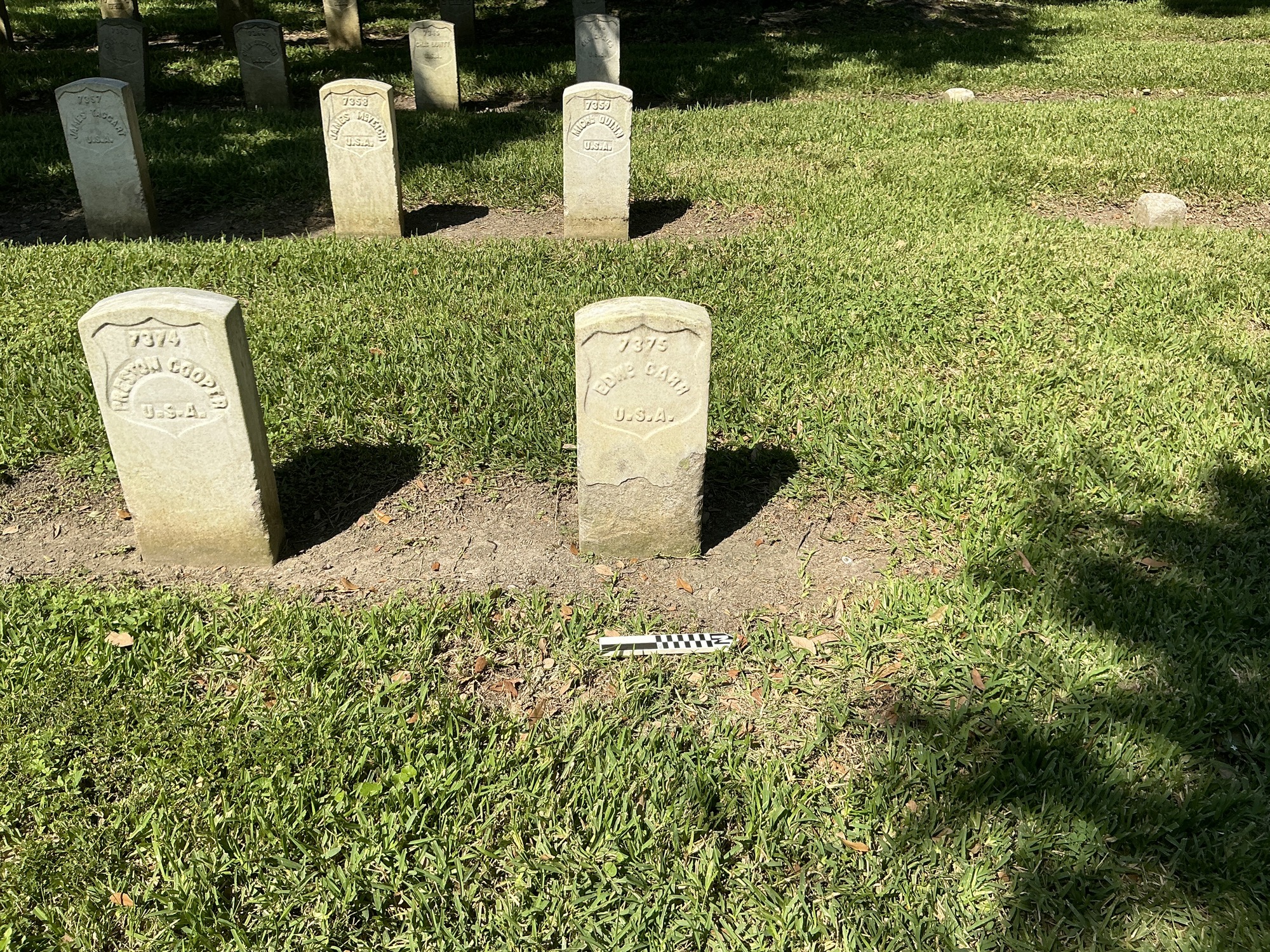 Extra image of historic upright marble headstone with recessed shield face.