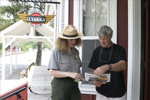 Ranger With Visitors Outside Peninsula Depot