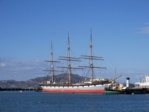 Balclutha docked on Hyde Street Pier, as viewed from the Aquatic Park Cove beach.