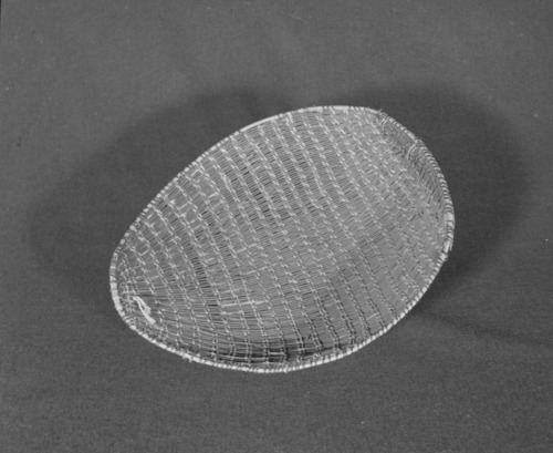 Marie Rozier Collection, Catalog No. 107. Object: Western Mono winnowing basket. Dimensions: 14 x 15". Materials: Redbud, chaparral rimstick. Technology: Diagonally twined, up to right slant of turns. Collection History: Property of Carmelita Ralph, purchased from her sister, Louise Fuentes, Central Miwok. Photographed by Michael Dixon in December 1982. Catalogued by Craig Bates and Barbara Beroza. Yosemite Collections, National Park Service.