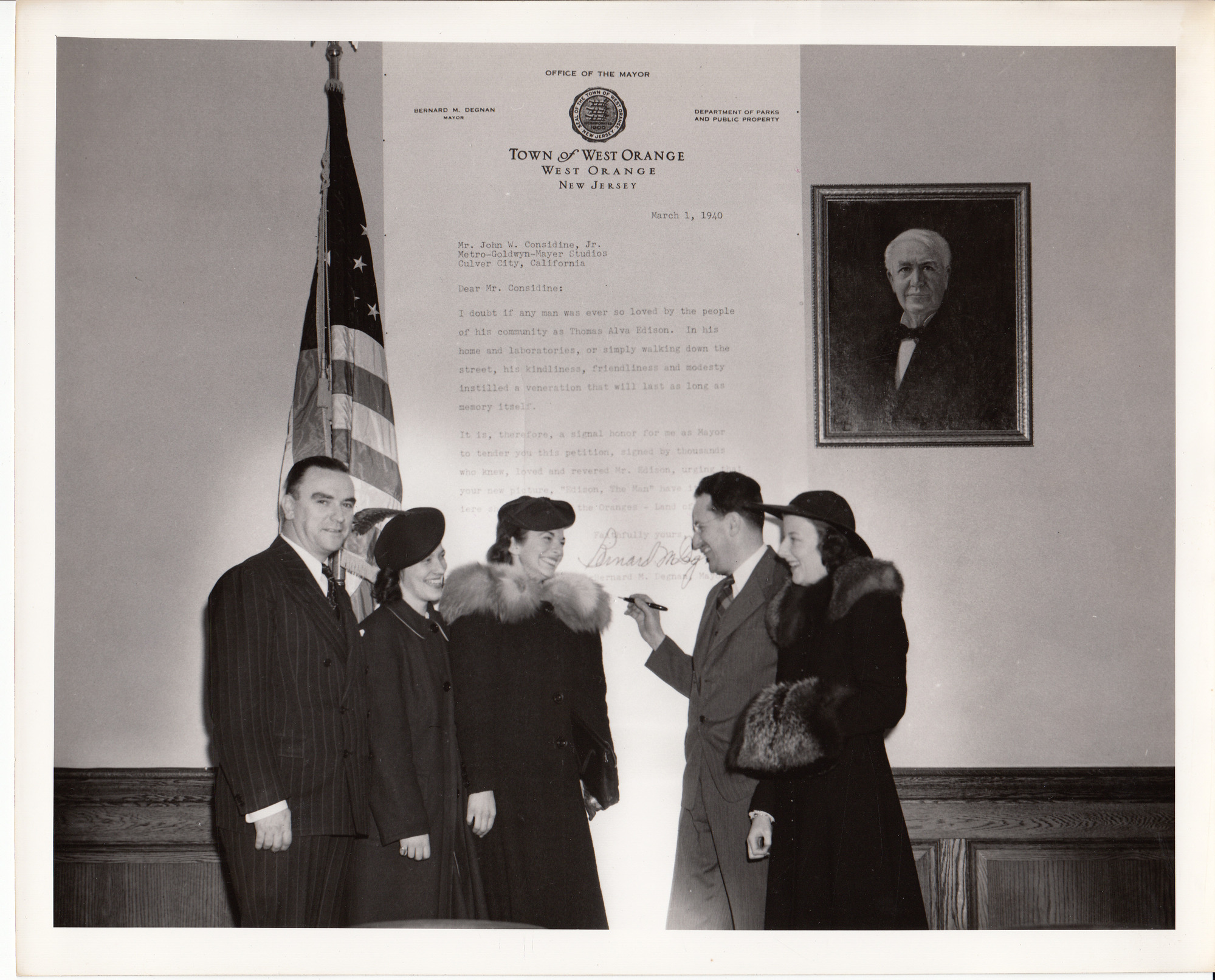 Mayor Bernard Degnan and others in front of petition requesting that the premiere of "Edison, the Man" be in The Oranges.