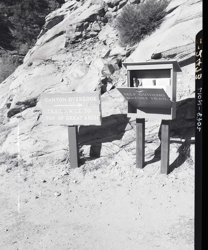 Trail sign and leaflet box for self-guiding nature trail for the Canyon Overlook Trail near the large tunnel.