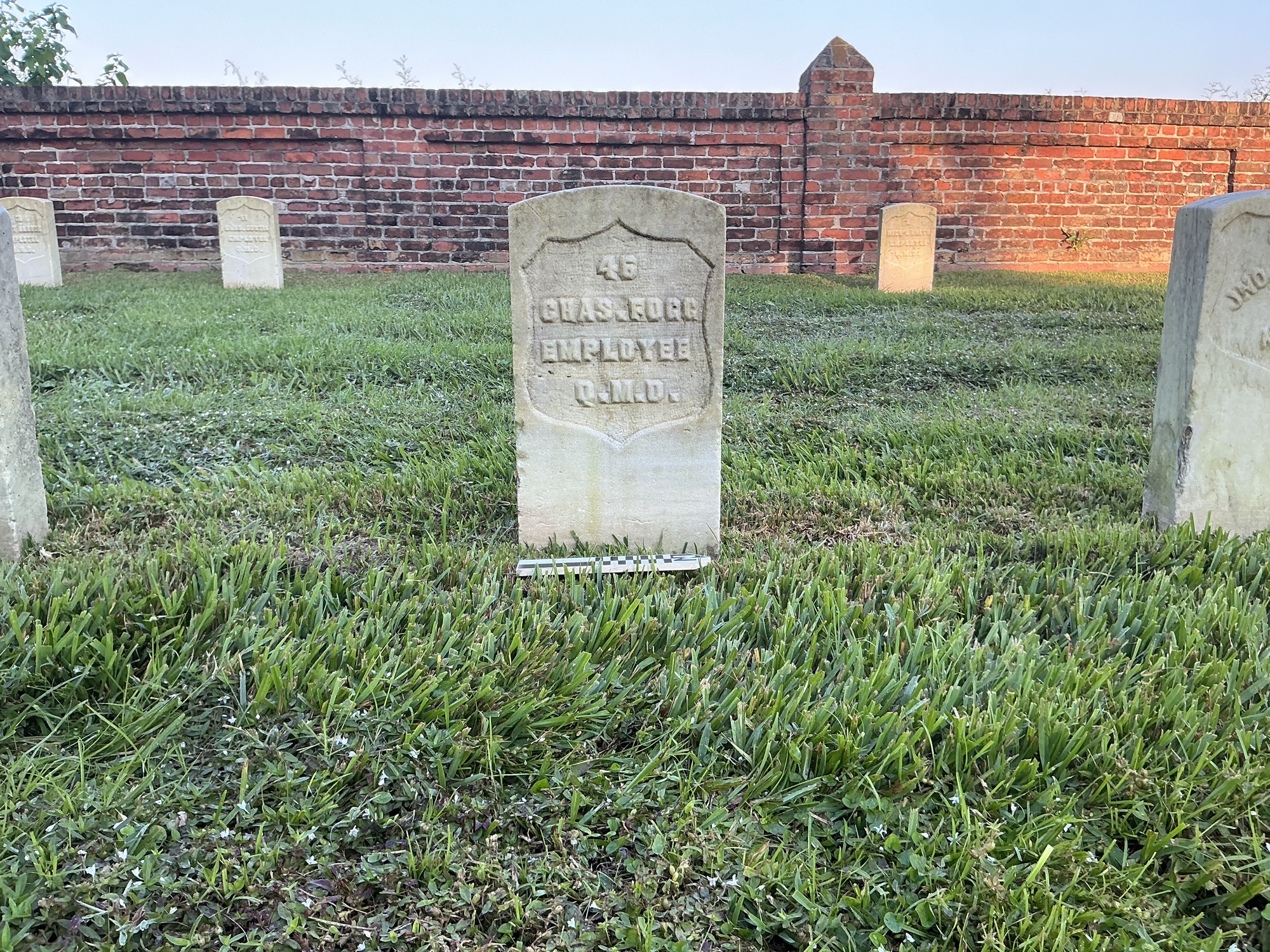 Extra image of historic upright marble headstone with recessed shield face.