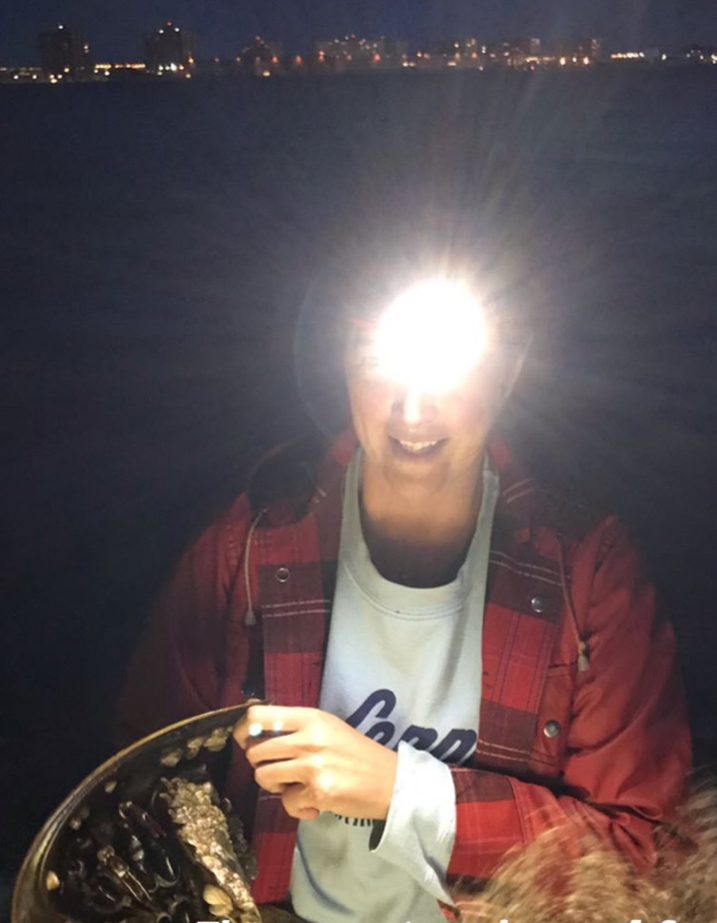 Heather Feather, book's author, shown with a headlamp