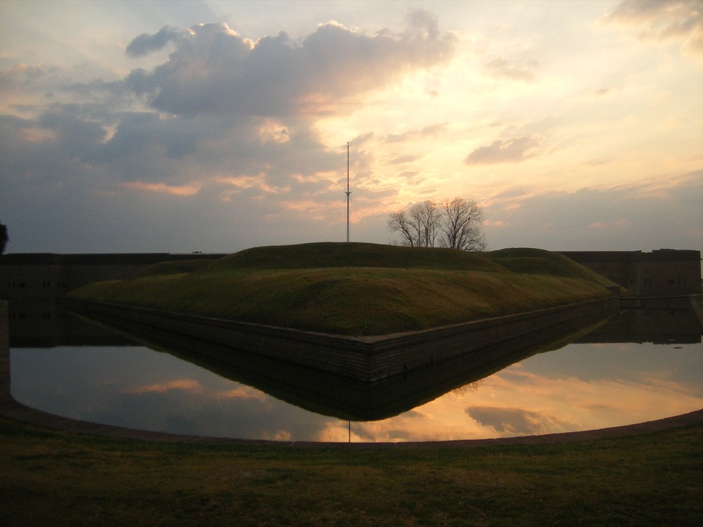 Flections of a partially cloudy sky on a body of water. 