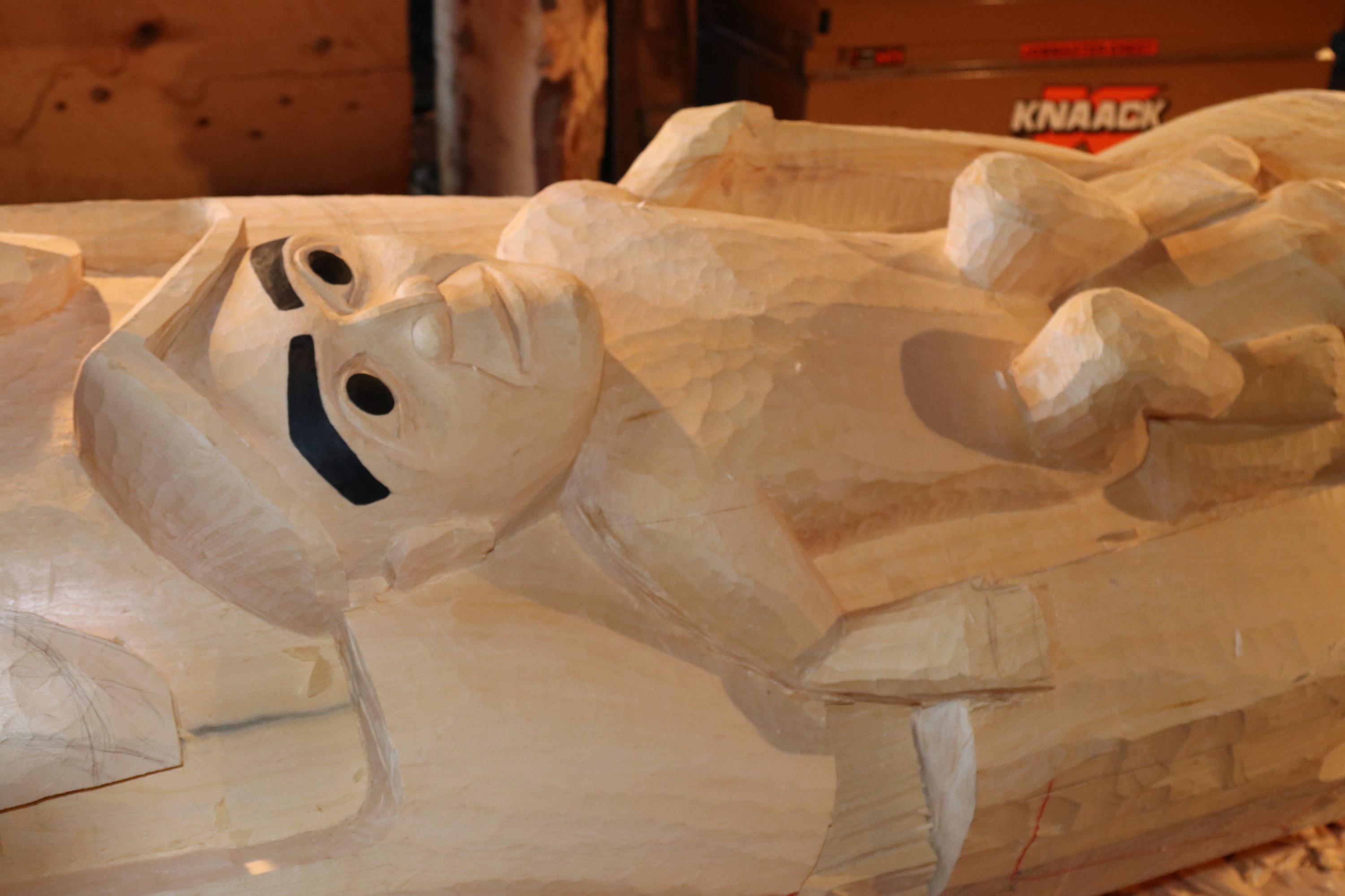 Youth figure, close up on the Waasgo Legend Pole