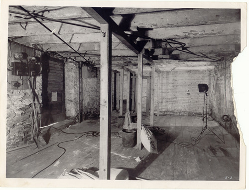 Equipment in the front room of Old Stone House during the 1950s restoration