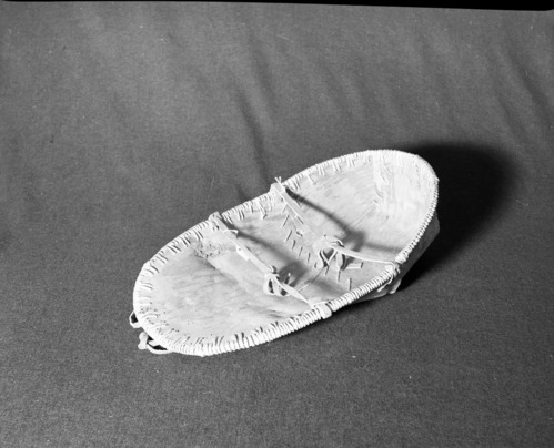 Marie Rozier Collection, Catalog No. ? Object: Athapascan (Interior Alaska). Dimensions: 20" high. Materials: birchbark, unidentified root, commercially-tanned moosehide. Collection History: Purchased in Alaska in 1976 for $49.50. Photographed by Michael Dixon, December 1982. Catalogued by Craig Bates and Barbara Beroza. Yosemite Collections, National Park Service.