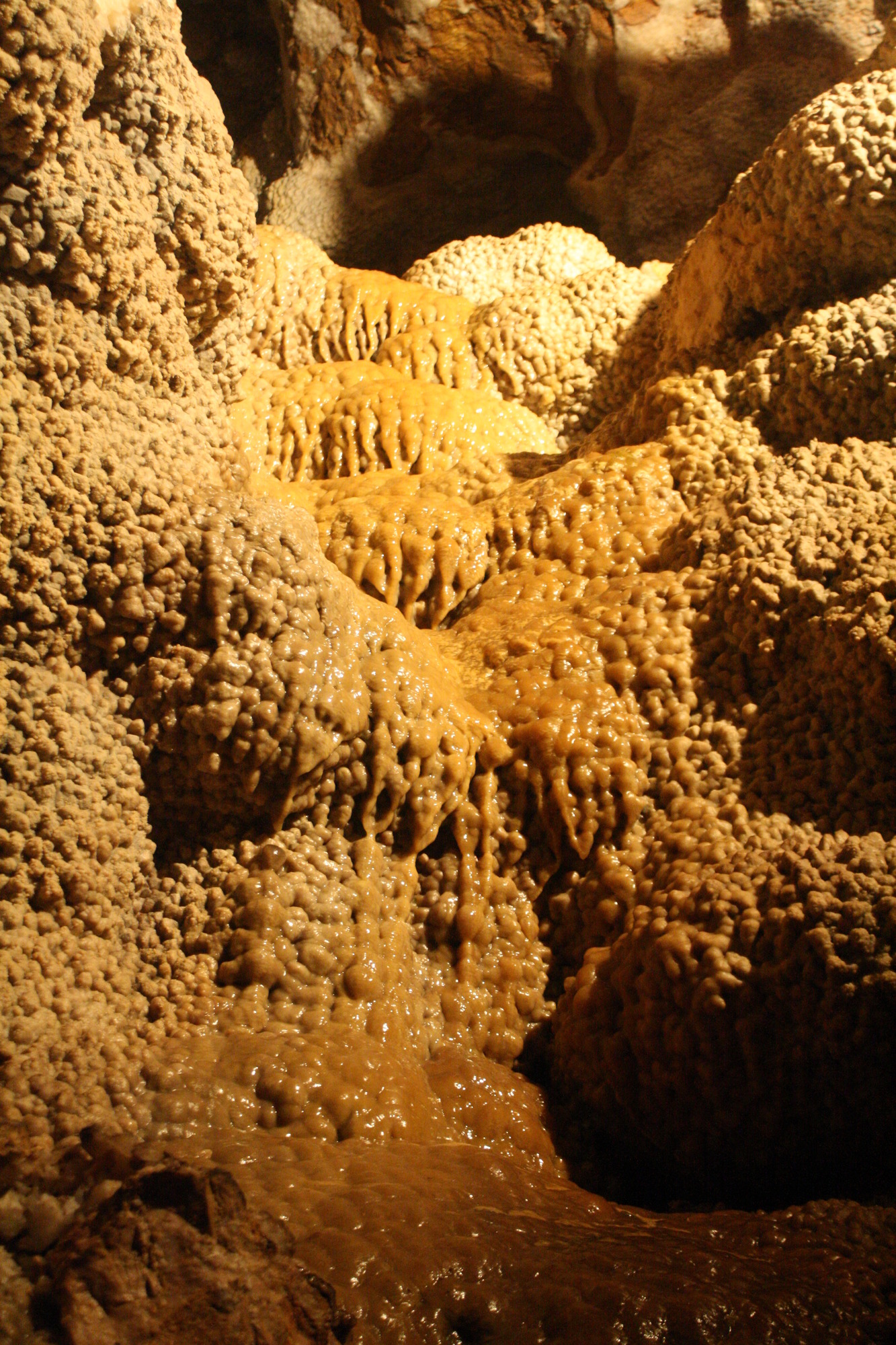 Flowstone over calcite crystal