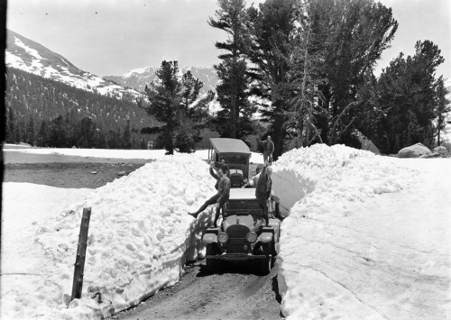 Tioga Pass area. In front - L to R: John Moore and Don Doig, Mgr. Touring Dept., Auto Club of Southern California. In back: A. B. Asher and E. B. Johnson, all of Auto Club - LA. [Slide: 201-SL09-1163].