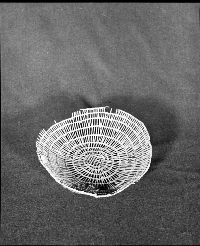 Marie Rozier Collection, Catalog No. 176. Object: Yurok/Karok/Hupa plate. Dimensions: 11 x 3". Materials: Hazel shoots. Technology: Plain twined, up to right slant of turns. Collection History: Purchased by Mary Long on Willow Creek Hupa Reservation. Photographed by Michael Dixon in December 1982. Catalogued by Craig Bates and Barbara Beroza. Yosemite Collections, National Park Service.