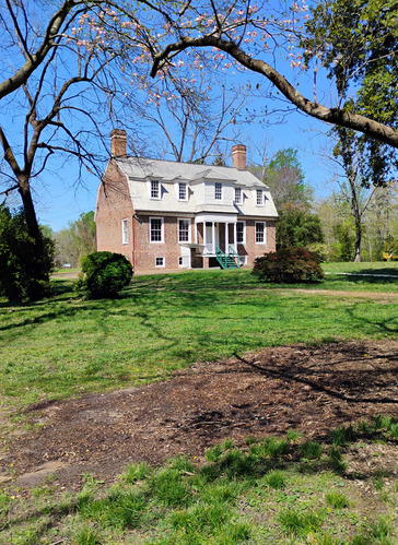 Angled front view of the Shelton House in Spring 2025.