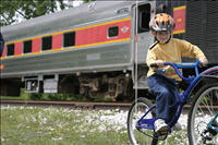 Cuyahoga Valley Scenic Railroad, Bikers Waiting to Board Train. In 2007 CVSR and NPS launched Bike Aboard!service to encourage use of the railroad as alternative transportation. For a $2 fare cyclists can ride the train in one direction and bike the other along the Ohio & Erie Canal Towpath Trail. Some images are at Rockside Station and others in Peninsula near the Peninsula Depot.