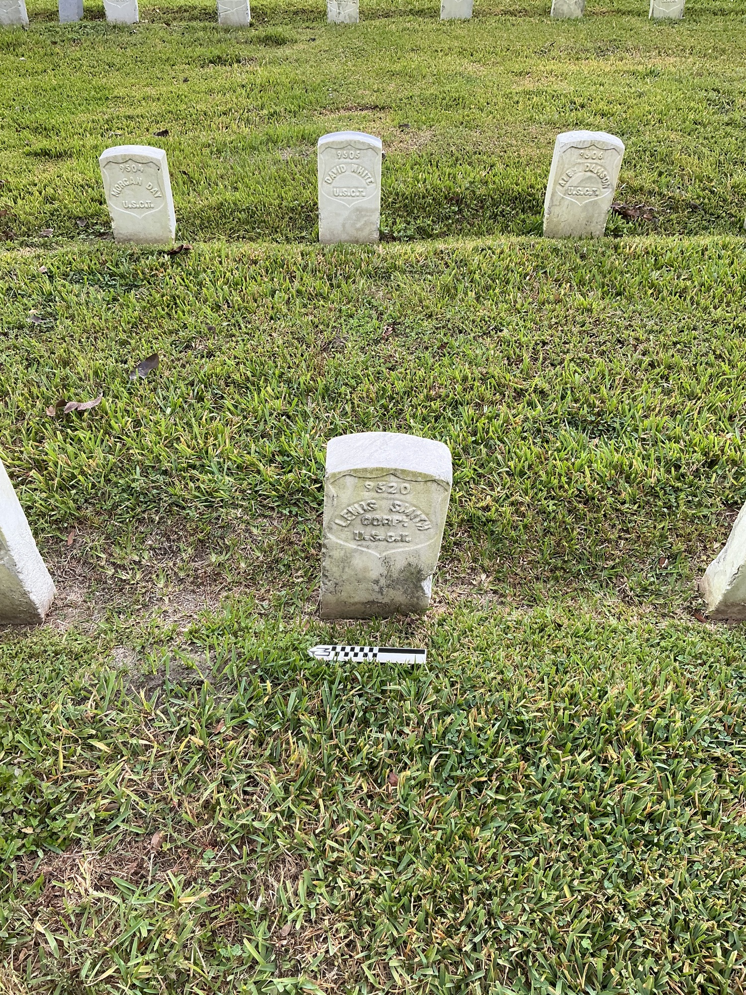 Extra image of historic upright marble headstone with recessed shield face.