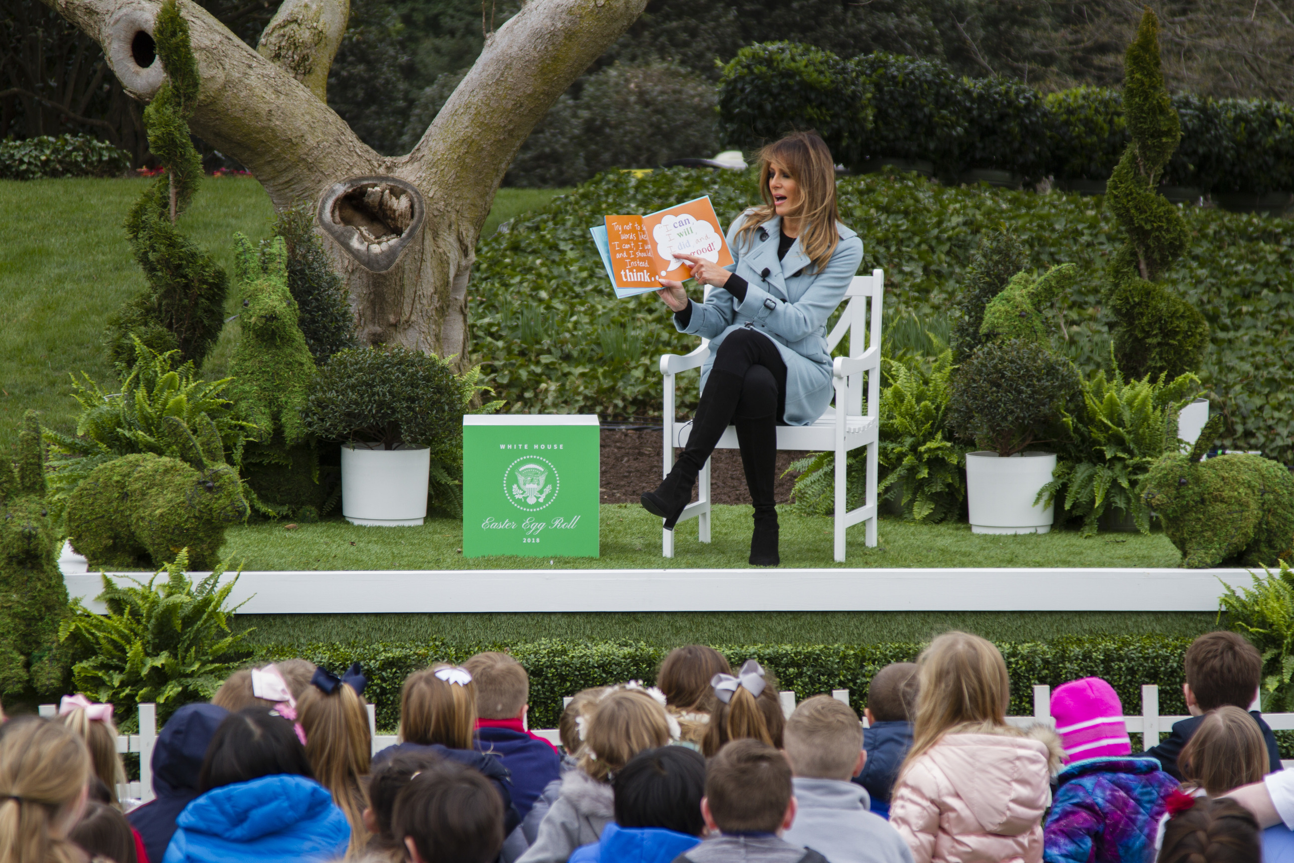 First Lady Melania Trump reads to a crowd of children in the book nook. 