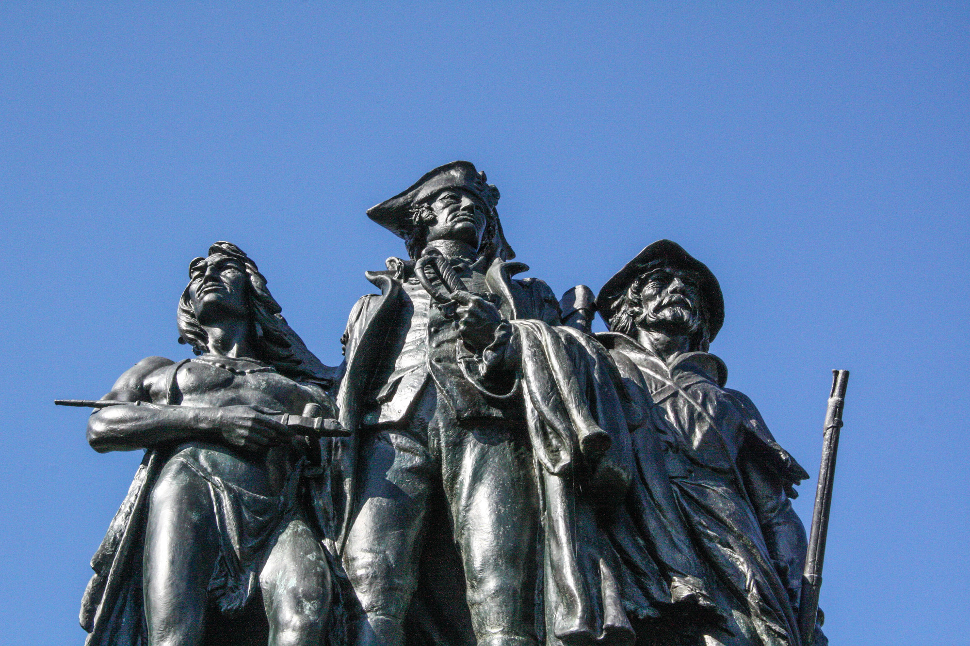 Statue of a Native American, soldier, and frontiersman