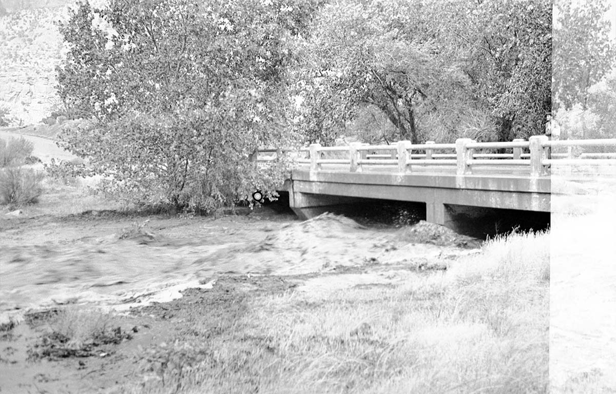 Oak Creek in flood near the Oak Creek bridge. Flood in progress.