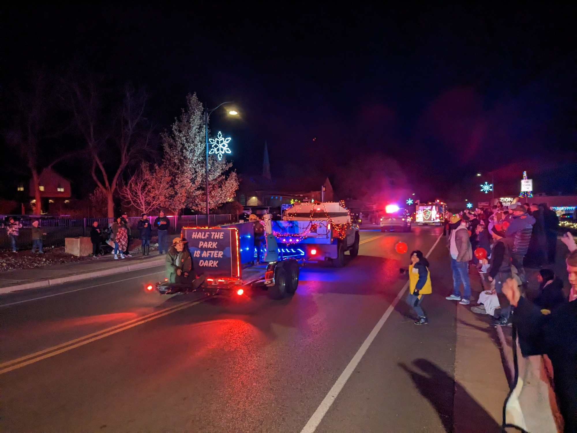 Park ranger sits on a float for the parade