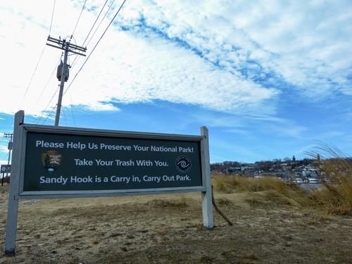 NPS official sign Please Help Us Preserve Your National Park Take Your Trash With You. Sandy Hook is a Carry In, Carry Out Park