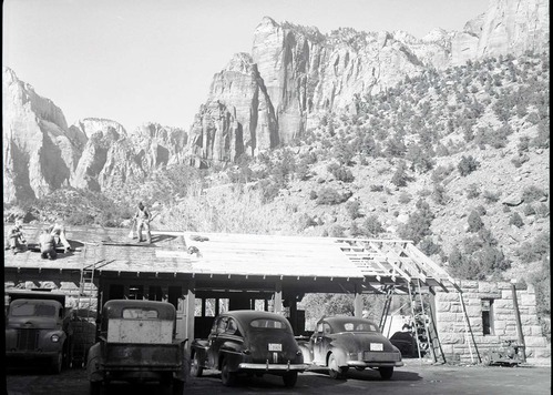 Reconstruction of machine shop, Building 77 after fire of January 3, 1953, restoring roof and enclosing one end for emergency work in shop.