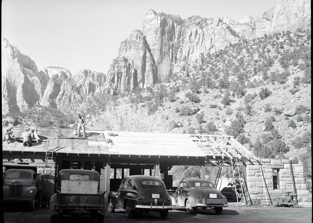 Reconstruction of machine shop, Building 77 after fire of January 3, 1953, restoring roof and enclosing one end for emergency work in shop.