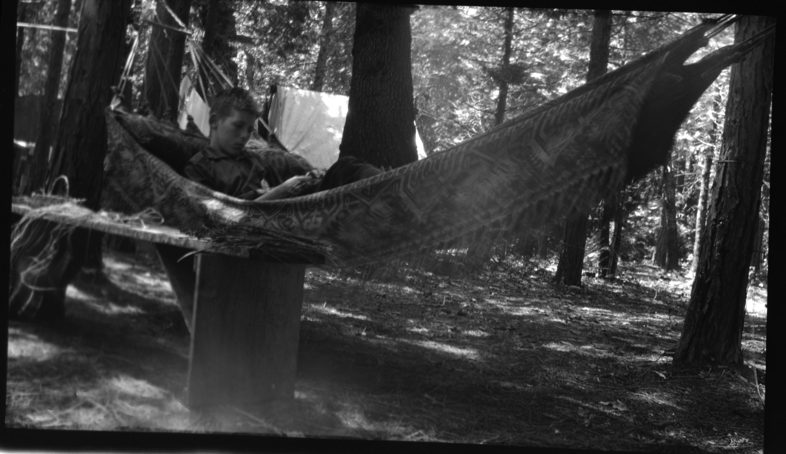 Camp 14. Yosemite Valley. warren Coolbaugh in hammock. Copied courtesy Mrs. Jean Coolbaugh Blasdale. Copied September 1983 by Michael Dixon.