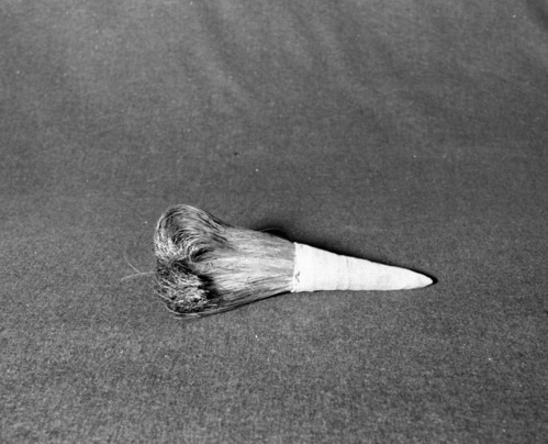 Marie Rozier Collection, Catalog No. 44. Object: Miwok soaproot brush. Dimensions: 9". Materials: soaproot, denim, cotton thread.Collection History: Never used. Made by Louise Fuentes for Marie Rozier. Photographed by Michael Dixon in December 1982. Catalogued by Craig Bates and Barbara Beroza. Yosemite Collections, National Park Service.