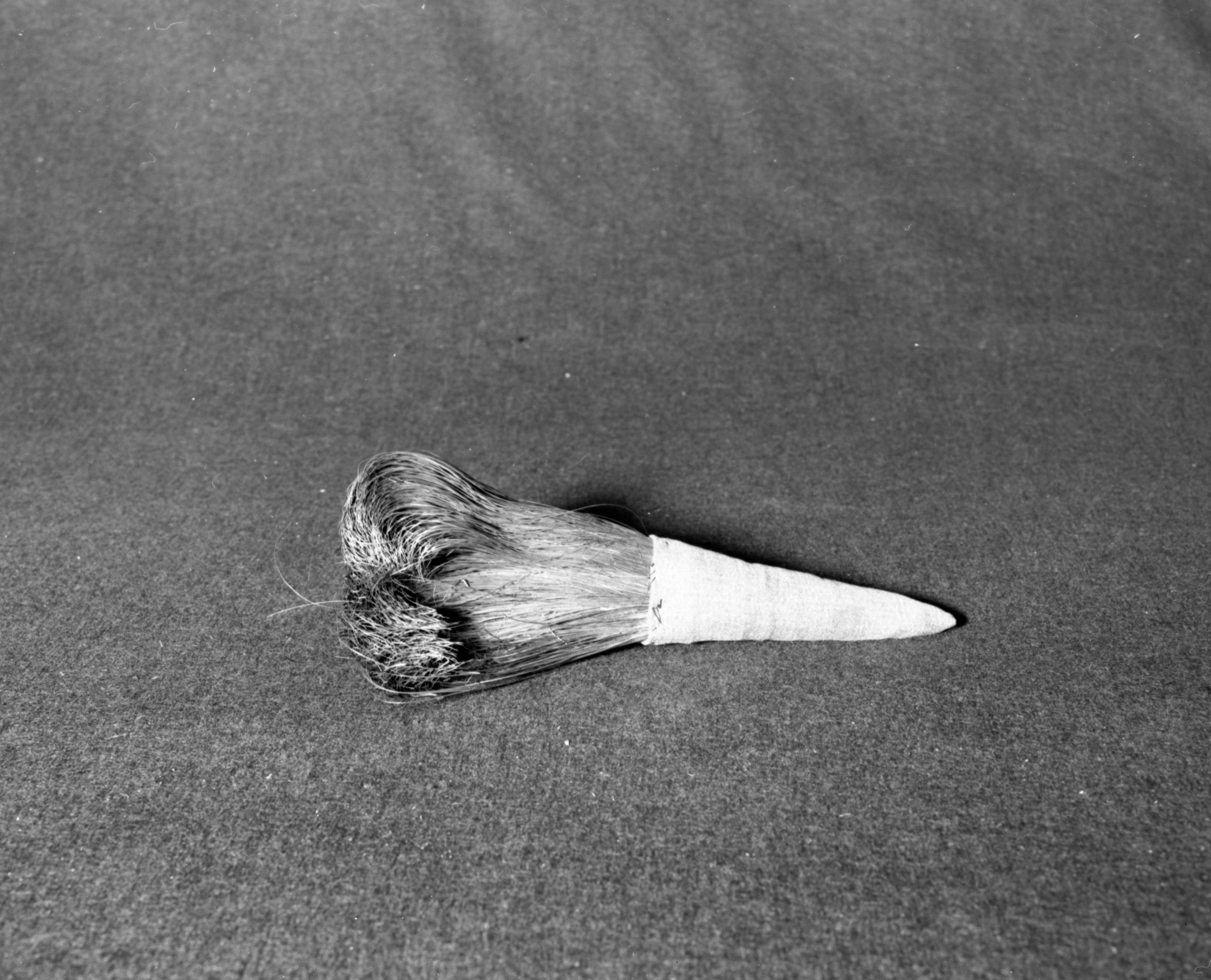 Marie Rozier Collection, Catalog No. 44. Object: Miwok soaproot brush. Dimensions: 9". Materials: soaproot, denim, cotton thread.Collection History: Never used. Made by Louise Fuentes for Marie Rozier. Photographed by Michael Dixon in December 1982. Catalogued by Craig Bates and Barbara Beroza. Yosemite Collections, National Park Service.