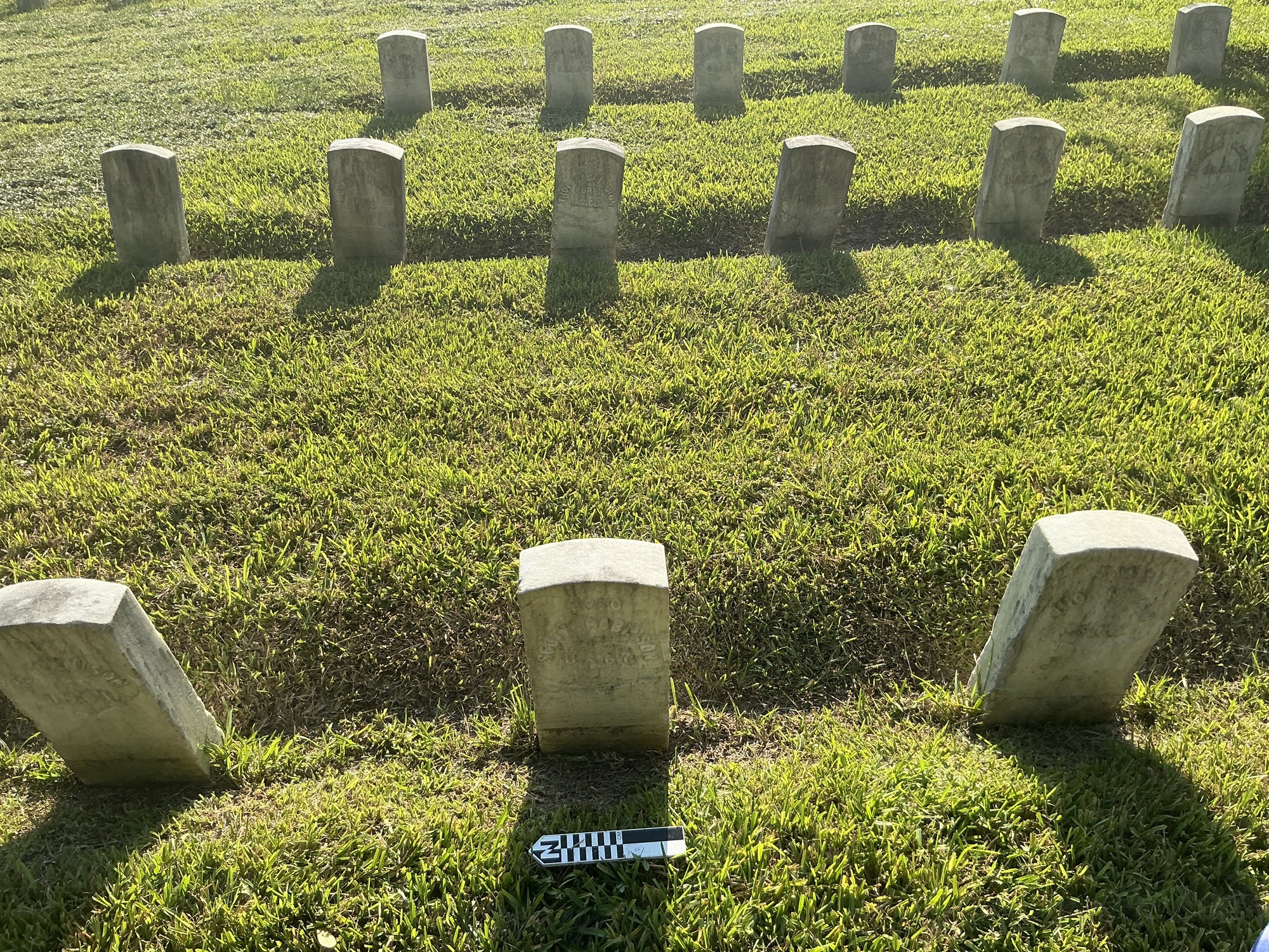Extra image of historic upright marble headstone with recessed shield face.