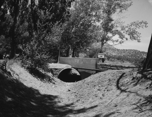 Culvert repair in progress at Pipe Spring National Monument. Sign reads: Pedestrian Lane.