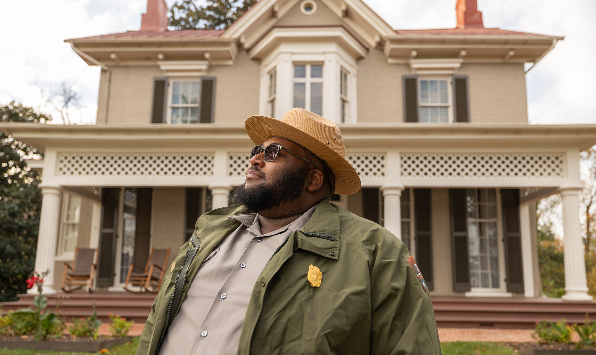 A Park Ranger stands in front of the Frederick Douglass House, 2023