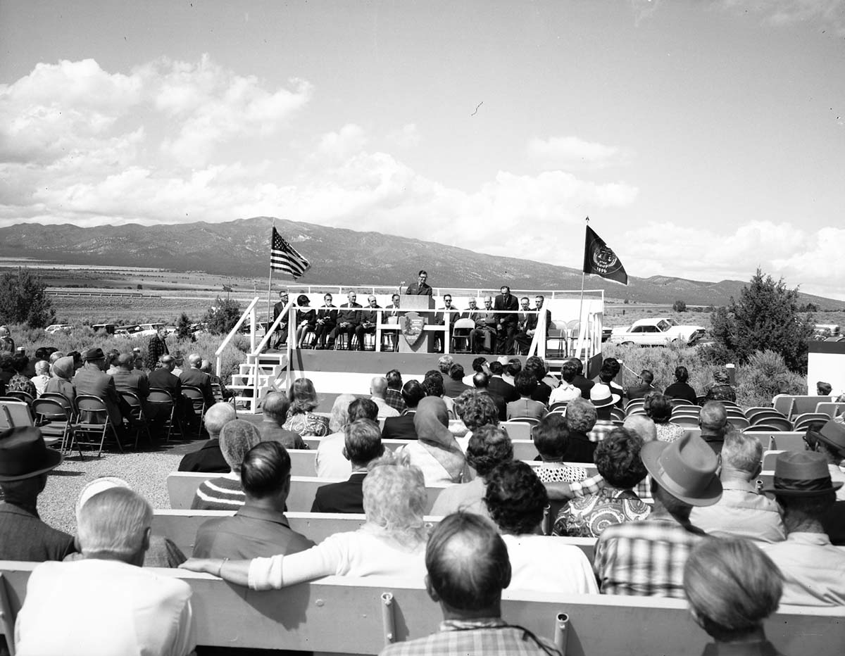 Warren F. Hamilton, Superintendent of Zion National Park, addressing visitors from podium at dedication of Taylor Creek road (Kolob Canyons).