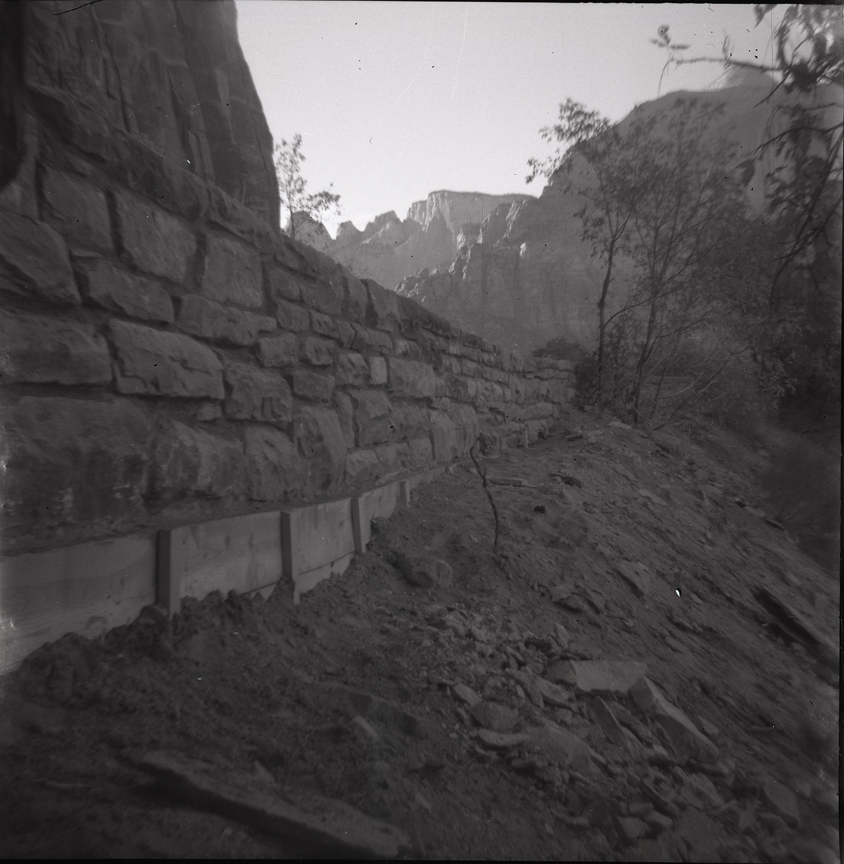 Rock retaining wall alongside road at the tunnel during rebuilding.