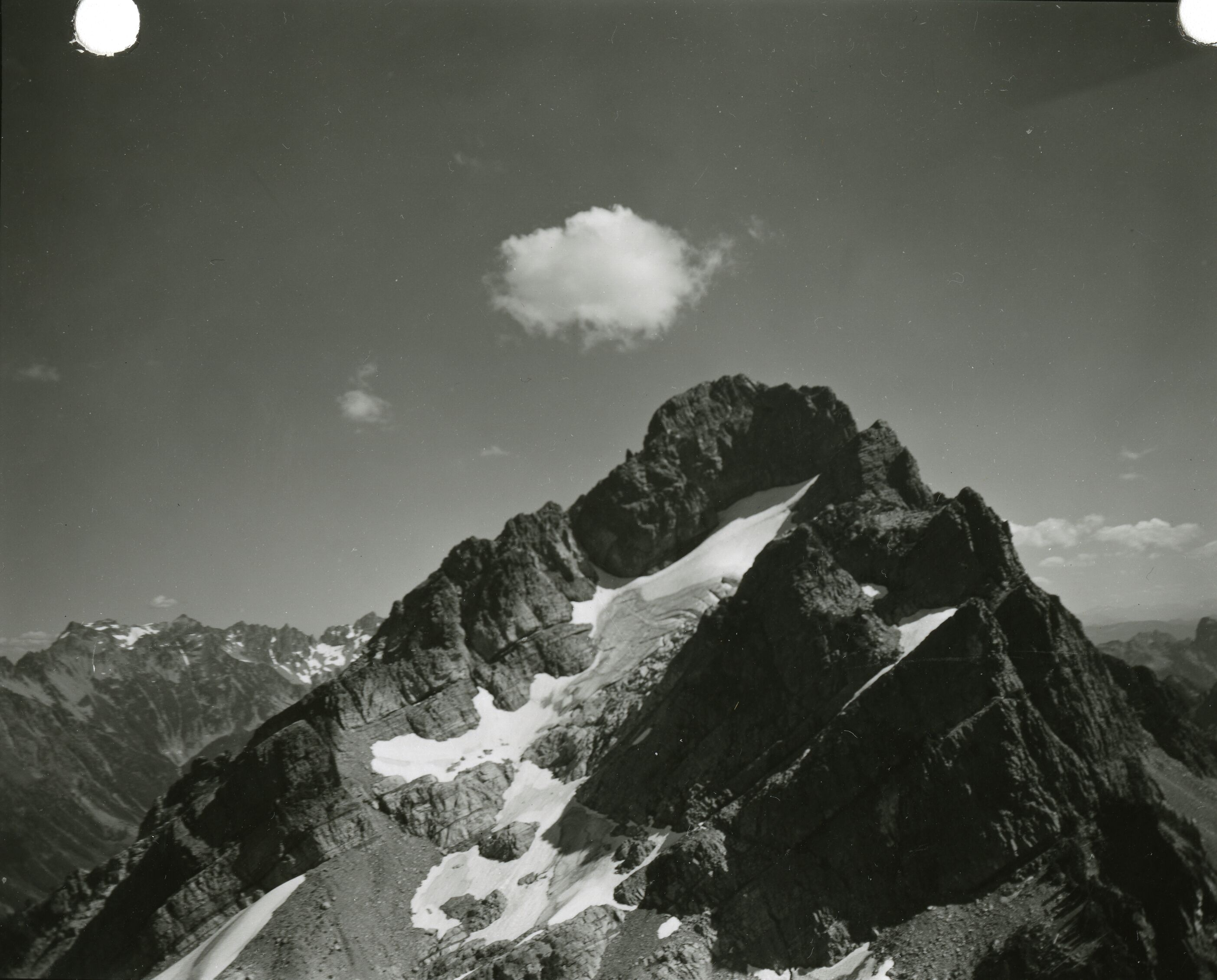 A glacier cascading down the side of a mountain.