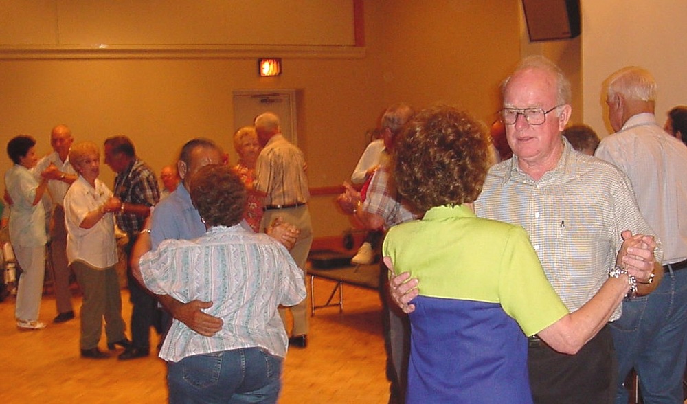 Volunteers demonstrate Cajun dancing at the Prairie Acadian Cultural Center