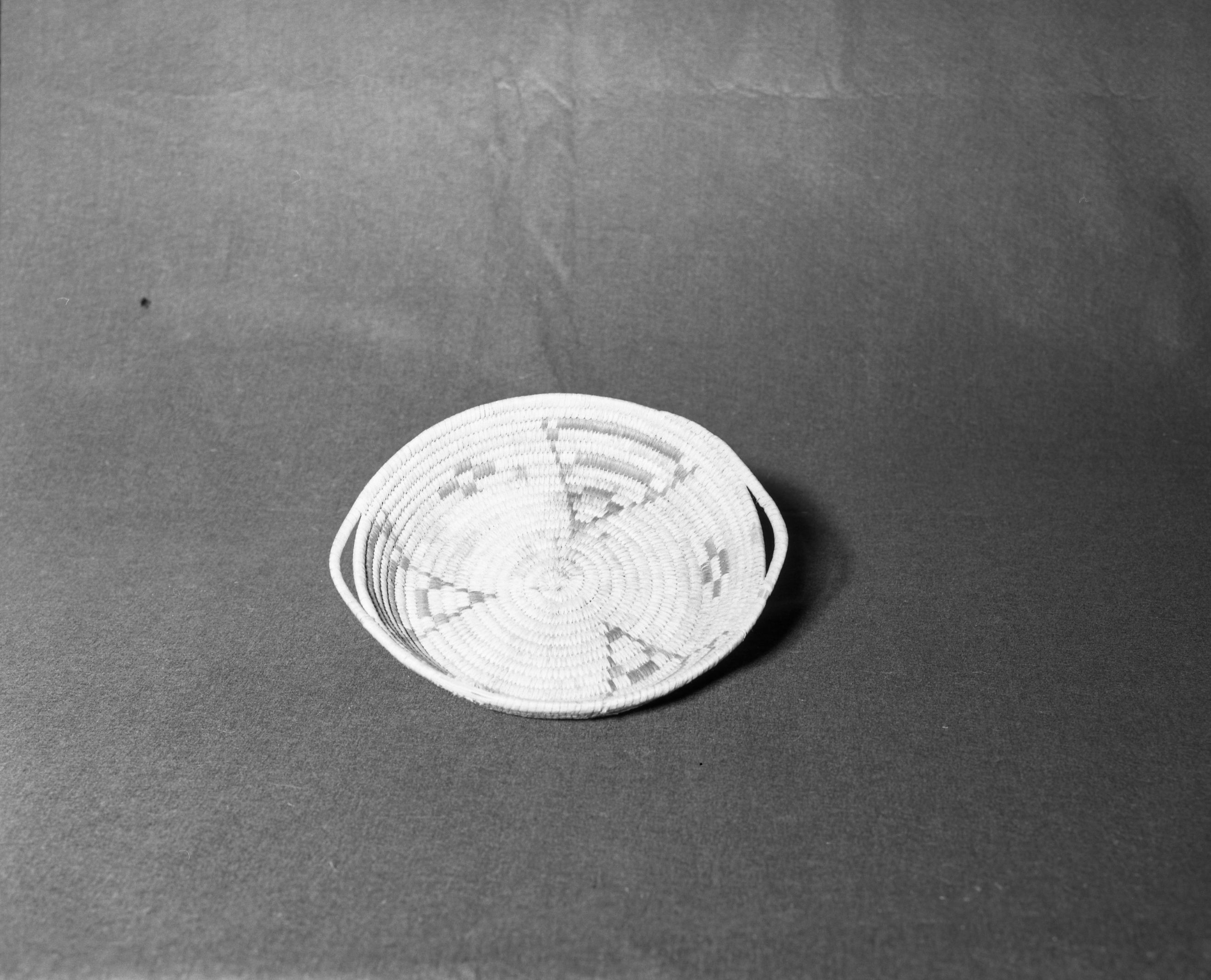 Mrs. Donald Segerstrom Collection. Object: Papago tray. Dimensions: 9 x 2". Materials: yucca, devil's claw. Technology: ---. Collection History: ---. Photographed by Michael Dixon, 1/83. Catalogued by Craig Bates and Barbara Beroza. Yosemite Collections, National Park Service.