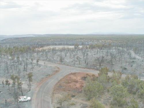 Aerial views of Chapin Mesa area in and around buildings depicting burn areas in the aftermath of the Long Mesa Fire at Mesa Verde National Park, August 2002