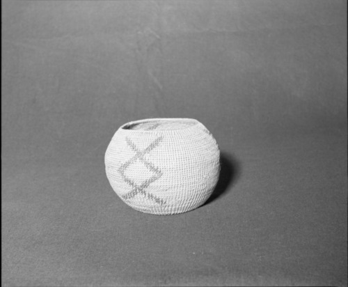 Mrs. Donald Segerstrom Collection. Object: Paiute basket. Dimensions: 8 x 6". Materials: willow and commercially-dyed willow. Technology: single rod foundation, leftward coil direction, non-interlocking stitch. Collection History: ---. Photographed by Michael Dixon, 1/83. Catalogued by Craig Bates and Barbara Beroza. Yosemite Collections, National Park Service.
