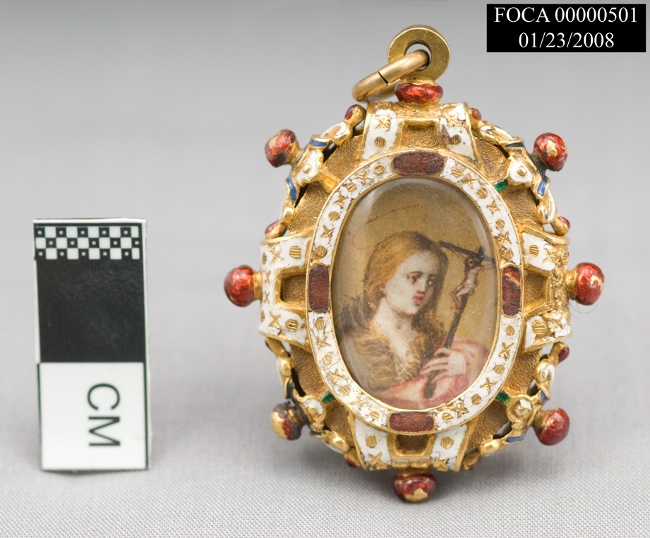 pendant with woman holding cross